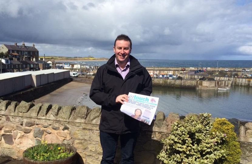 Stephen Bates supporting the campaign in Seahouses-Bamburgh castle in background
